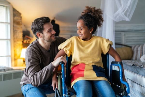 Care giver with a child on wheelchair for Accommodation Tenancy IMG