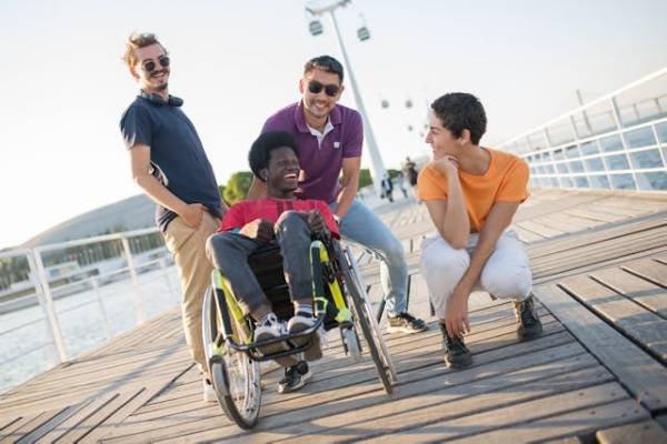 People with man on wheel chair for Innovative Community Participation IMG